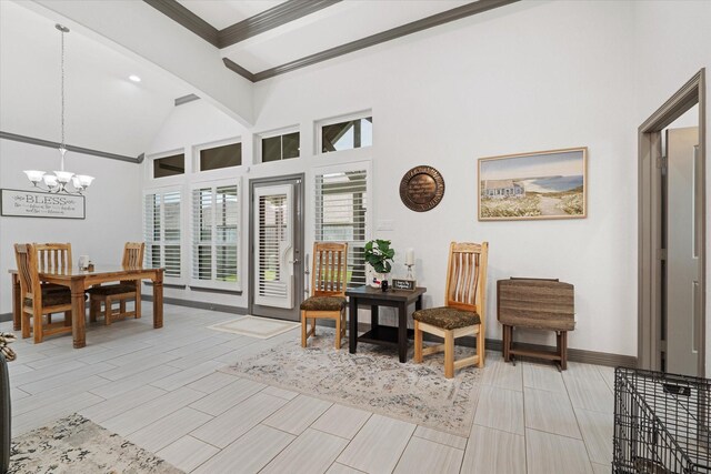 106 Comal Dr, Baytown, TX 77523 - living area with a chandelier, crown molding, lofted ceiling, and baseboards
