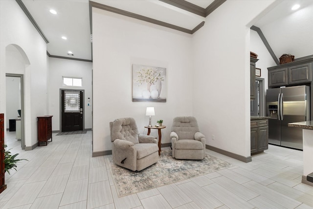 106 Comal Dr, Baytown, TX 77523 - sitting room featuring arched walkways, ornamental molding, recessed lighting, vaulted ceiling, and baseboards