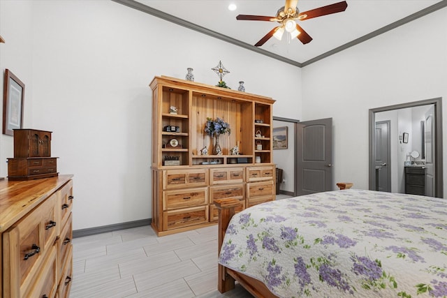 106 Comal Dr, Baytown, TX 77523 - bedroom with crown molding, a high ceiling, baseboards, ensuite bath, and a ceiling fan