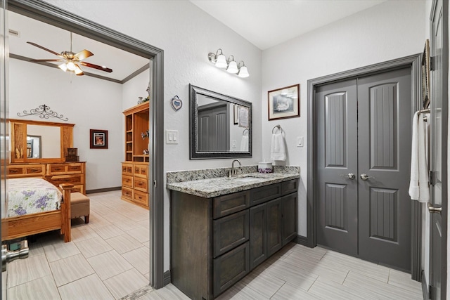 106 Comal Dr, Baytown, TX 77523 - ensuite bathroom with a ceiling fan, vanity, tile patterned flooring, and baseboards