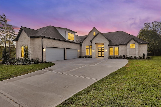 11401 E Zoe Loop, Montgomery, TX 77316 - french country style house with driveway, brick siding, a front yard, and a garage