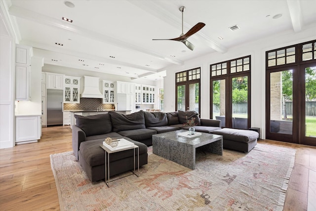 5420 Maple St, Bellaire, TX 77401 - living area featuring french doors, light wood finished floors, a ceiling fan, beam ceiling, and ornamental molding
