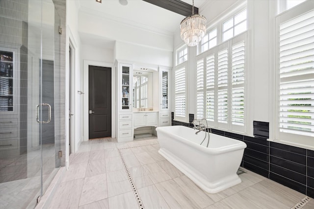 5420 Maple St, Bellaire, TX 77401 - bathroom with crown molding, a freestanding tub, a stall shower, a chandelier, and vanity