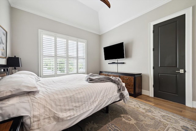 5420 Maple St, Bellaire, TX 77401 - bedroom with wood finished floors, crown molding, and baseboards