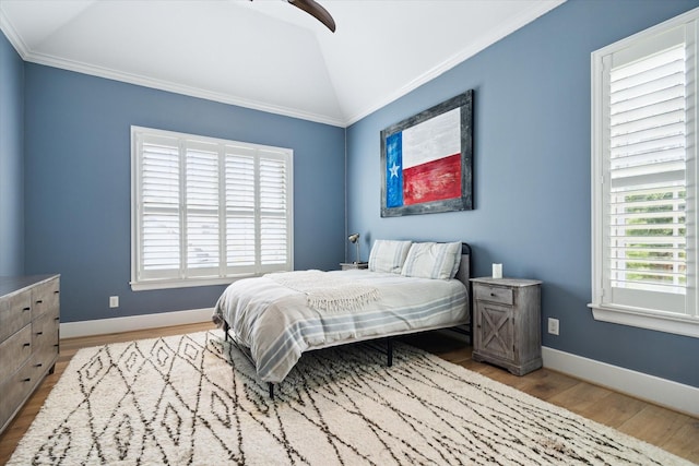 5420 Maple St, Bellaire, TX 77401 - bedroom featuring wood finished floors, crown molding, lofted ceiling, baseboards, and ceiling fan