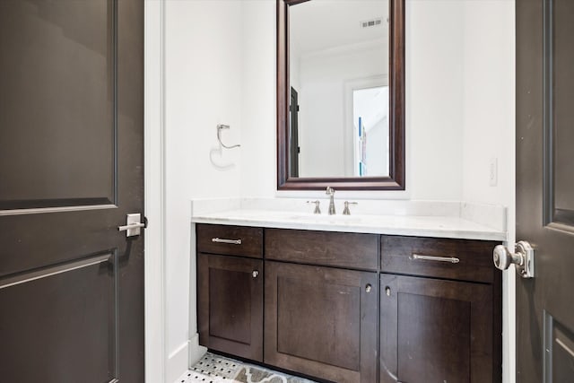 5420 Maple St, Bellaire, TX 77401 - bathroom featuring vanity and ornamental molding