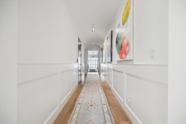 5420 Maple St, Bellaire, TX 77401 - hallway featuring light wood-style floors and wainscoting