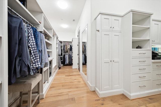 5420 Maple St, Bellaire, TX 77401 - walk in closet with light wood finished floors