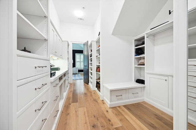 5420 Maple St, Bellaire, TX 77401 - walk in closet with light wood finished floors