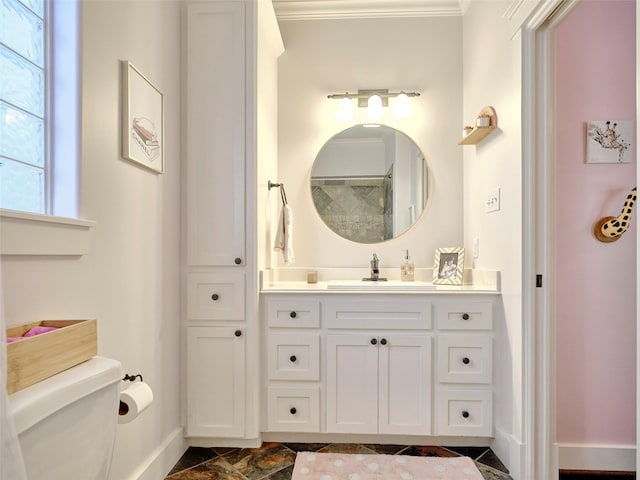 228 E Woodland St, Houston, TX 77009 - full bath with vanity, toilet, crown molding, a shower, and baseboards