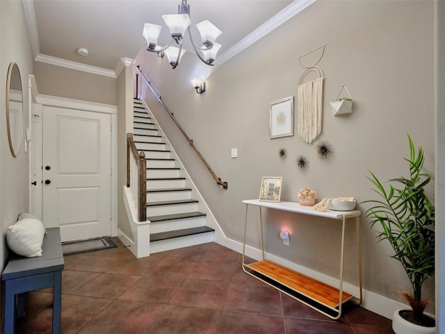 228 E Woodland St, Houston, TX 77009 - entrance foyer with ornamental molding, stairway, a chandelier, baseboards, and dark tile patterned flooring