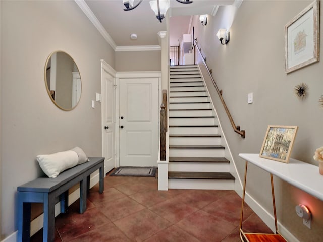 228 E Woodland St, Houston, TX 77009 - tiled foyer featuring ornamental molding and stairs