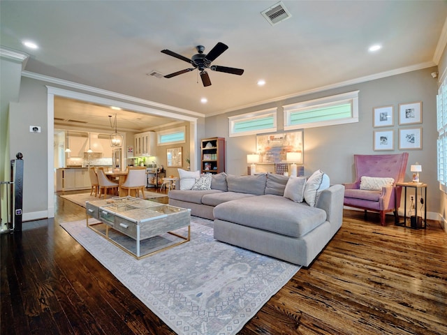 228 E Woodland St, Houston, TX 77009 - living area featuring dark wood finished floors, ornamental molding, a ceiling fan, baseboards, and recessed lighting