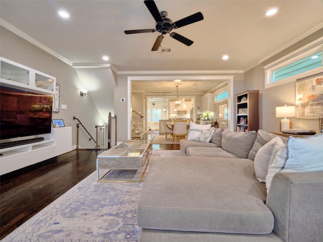 228 E Woodland St, Houston, TX 77009 - living area featuring crown molding, dark wood-style floors, recessed lighting, ceiling fan, and stairway
