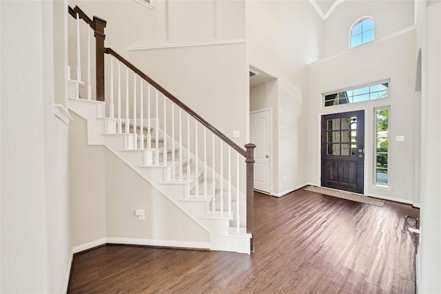 2635 Cedar Path Ln, Conroe, TX 77385 - entryway with wood finished floors, a high ceiling, stairs, and baseboards
