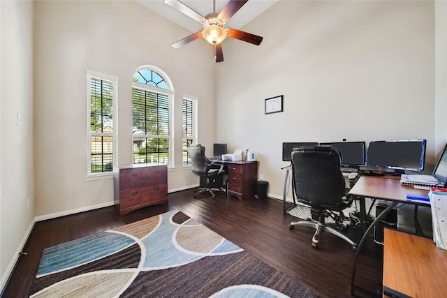 2635 Cedar Path Ln, Conroe, TX 77385 - home office with a ceiling fan, baseboards, wood finished floors, and a high ceiling