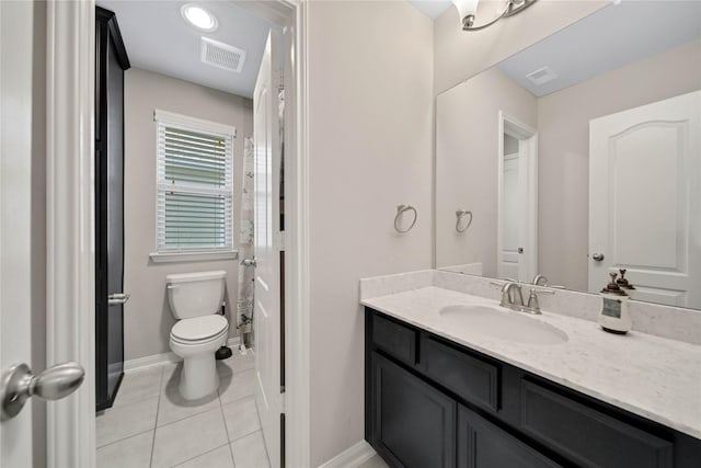 2635 Cedar Path Ln, Conroe, TX 77385 - full bathroom with vanity, tile patterned flooring, baseboards, toilet, and a shower