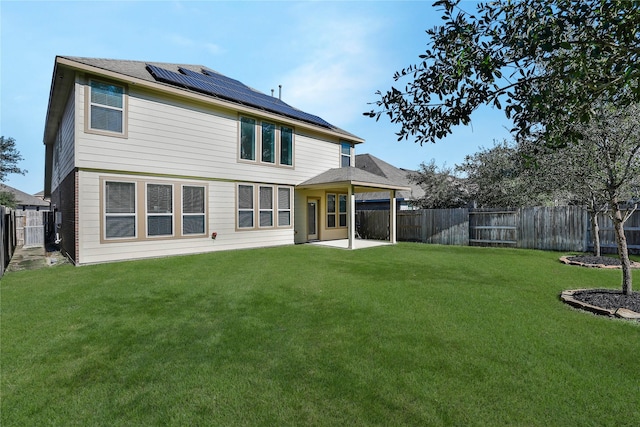 2635 Cedar Path Ln, Conroe, TX 77385 - rear view of property with roof mounted solar panels and a patio