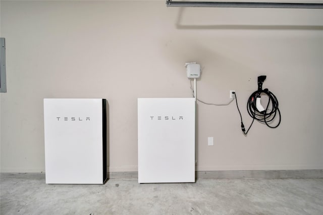 2635 Cedar Path Ln, Conroe, TX 77385 - garage view of a power storage unit, concrete floors, and electric vehicle charger