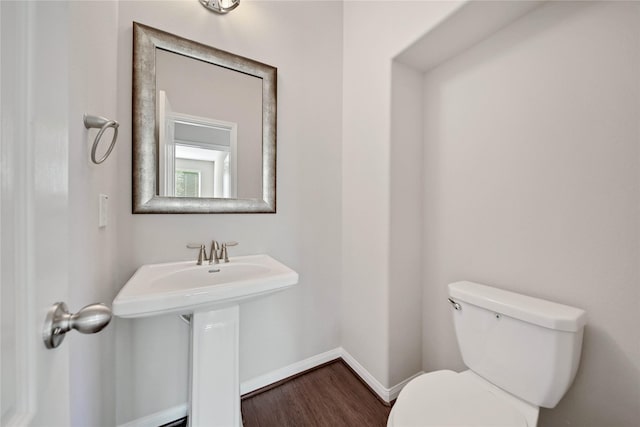 2635 Cedar Path Ln, Conroe, TX 77385 - bathroom featuring toilet, wood finished floors, and baseboards