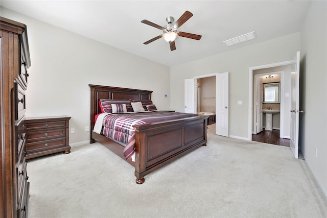 2635 Cedar Path Ln, Conroe, TX 77385 - bedroom with light colored carpet, baseboards, ceiling fan, and a sink