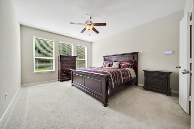 2635 Cedar Path Ln, Conroe, TX 77385 - bedroom with light colored carpet, baseboards, and a ceiling fan