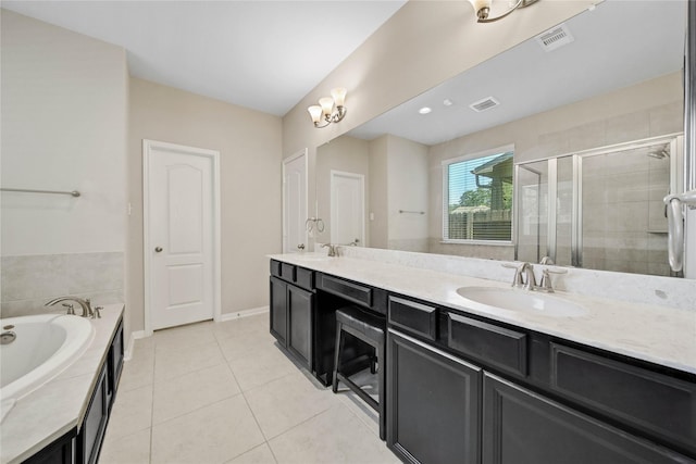 2635 Cedar Path Ln, Conroe, TX 77385 - bathroom with double vanity, a bath, a stall shower, tile patterned floors, and baseboards