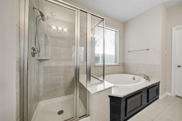 2635 Cedar Path Ln, Conroe, TX 77385 - bathroom with a stall shower, a bath, and tile patterned flooring