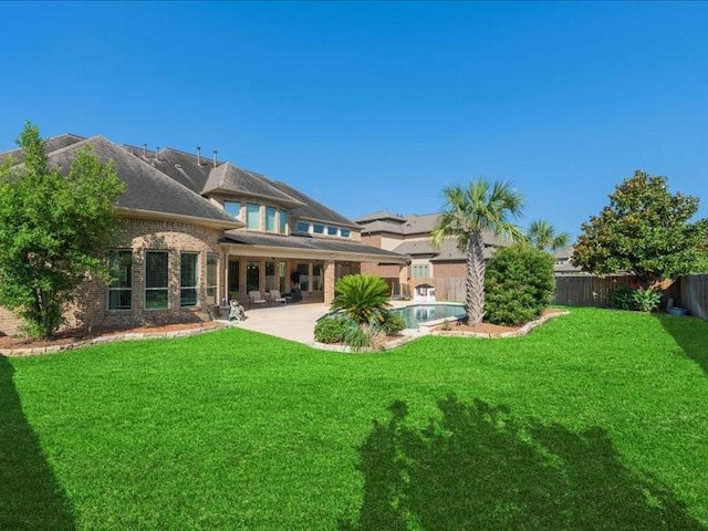 20326 Scarlett Saddle Ct, Cypress, TX 77433 - rear view of house with a patio and brick siding