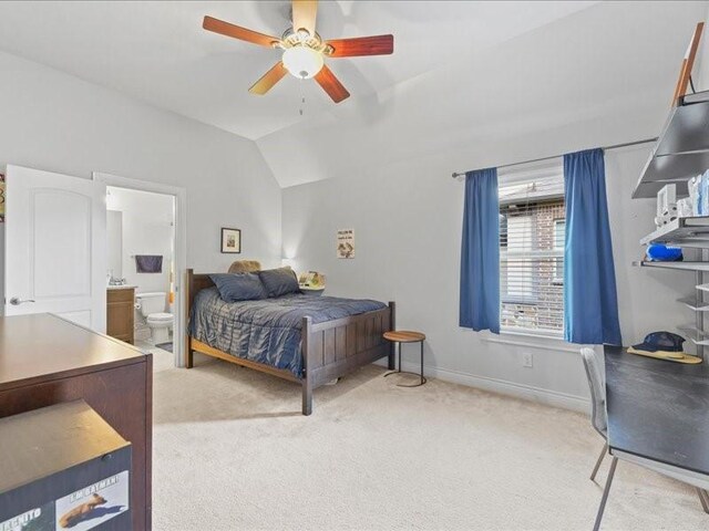 20326 Scarlett Saddle Ct, Cypress, TX 77433 - carpeted bedroom featuring lofted ceiling, connected bathroom, baseboards, and a ceiling fan