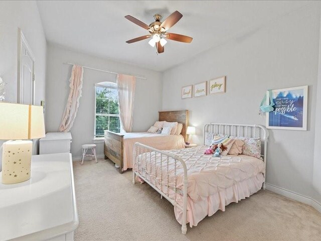 20326 Scarlett Saddle Ct, Cypress, TX 77433 - bedroom with light colored carpet, baseboards, and ceiling fan