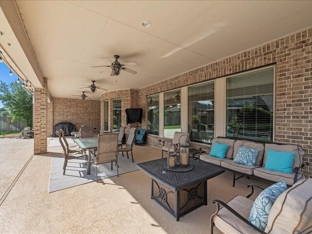 20326 Scarlett Saddle Ct, Cypress, TX 77433 - view of patio featuring outdoor lounge area, a ceiling fan, and outdoor dining area