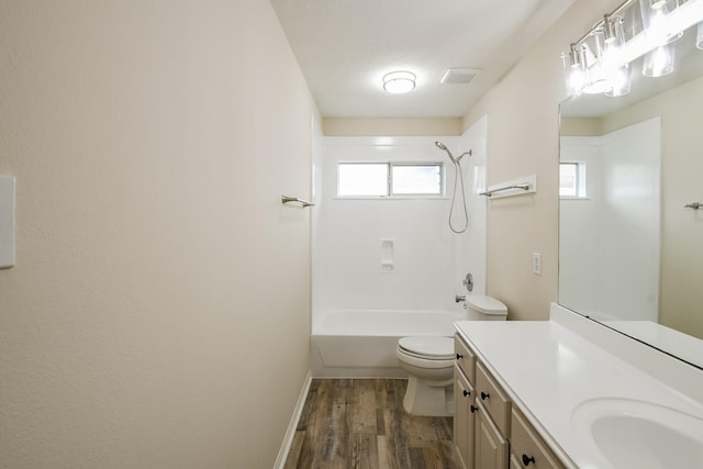 9203 Windy Spring Ct, Houston, TX 77089 - full bath with wood finished floors, vanity, toilet, shower / bathtub combination, and baseboards