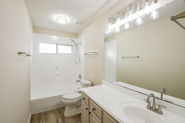 9203 Windy Spring Ct, Houston, TX 77089 - full bathroom featuring vanity, wood finished floors, toilet, and washtub / shower combination