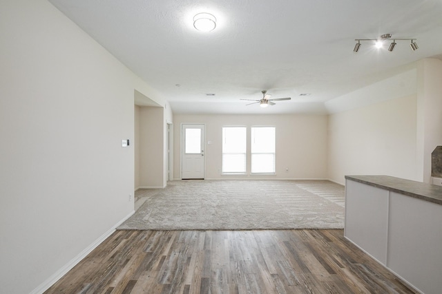 9203 Windy Spring Ct, Houston, TX 77089 - unfurnished living room featuring a ceiling fan, baseboards, and wood finished floors