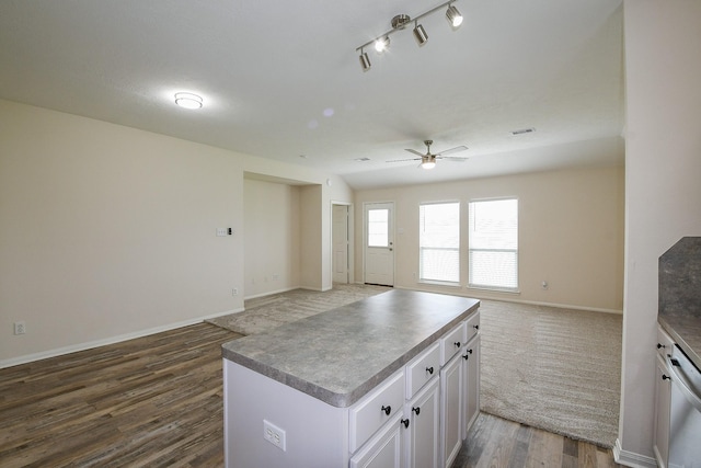 9203 Windy Spring Ct, Houston, TX 77089 - kitchen featuring open floor plan, a ceiling fan, white cabinets, wood finished floors, and dishwasher