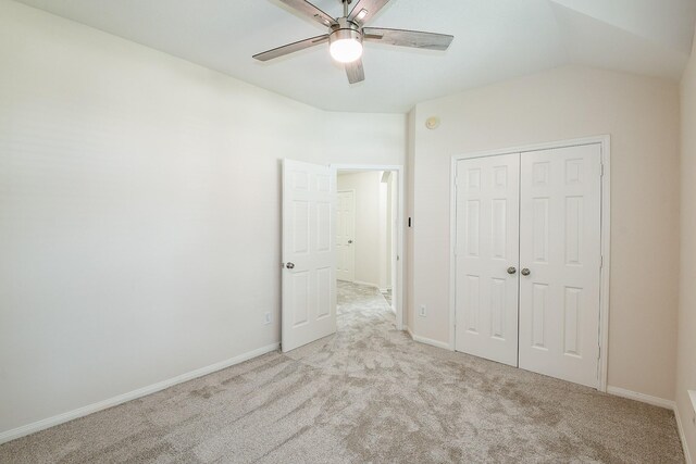 9203 Windy Spring Ct, Houston, TX 77089 - unfurnished bedroom with carpet flooring, a closet, baseboards, vaulted ceiling, and ceiling fan