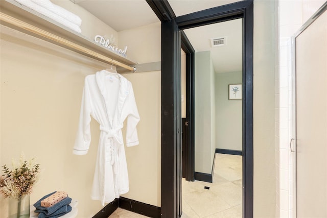 18138 Bal Harbour Dr, Houston, TX 77058 - hallway featuring light tile patterned flooring and baseboards