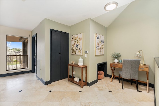 18138 Bal Harbour Dr, Houston, TX 77058 - office area featuring baseboards, light tile patterned floors, and vaulted ceiling