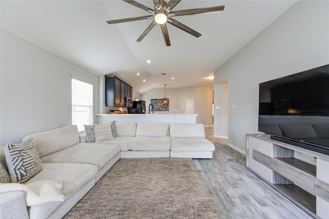 21811 Blossom Grove Ln, Spring, TX 77379 - living area with lofted ceiling, light wood finished floors, ceiling fan, baseboards, and recessed lighting