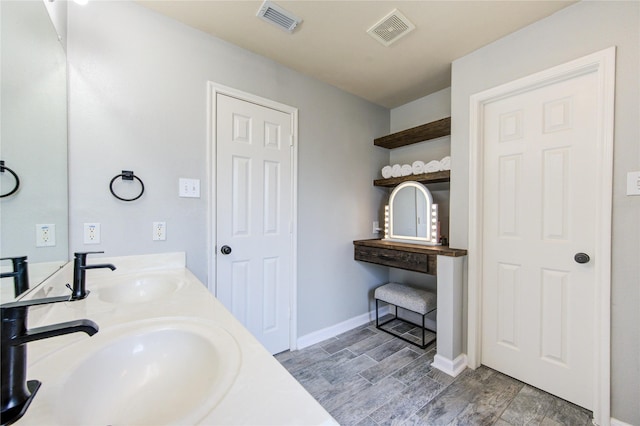 21811 Blossom Grove Ln, Spring, TX 77379 - bathroom featuring double vanity and baseboards