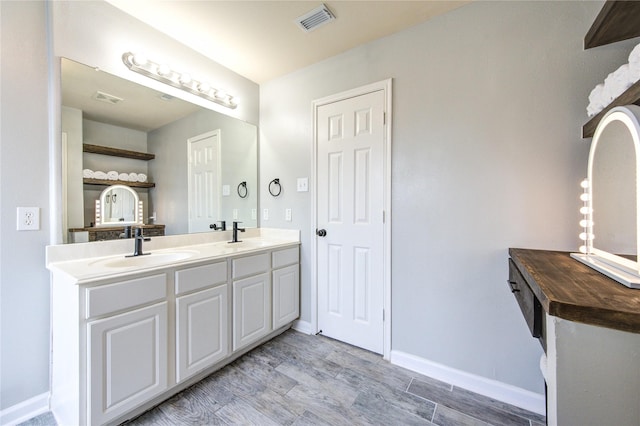 21811 Blossom Grove Ln, Spring, TX 77379 - full bath with double vanity, wood finished floors, and baseboards