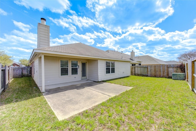 21811 Blossom Grove Ln, Spring, TX 77379 - back of house featuring a chimney and a patio area