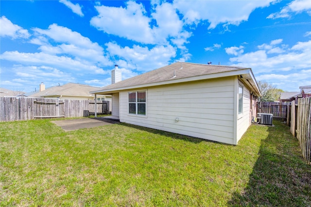 21811 Blossom Grove Ln, Spring, TX 77379 - back of house with cooling unit, a patio, and a chimney