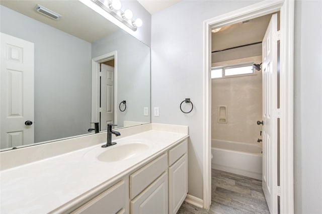 21811 Blossom Grove Ln, Spring, TX 77379 - full bathroom with vanity, wood finished floors, and bathtub / shower combination