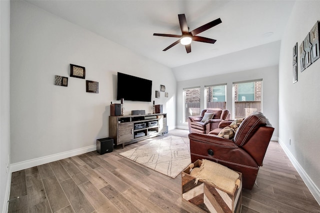 7118 Kinglet Ct, Katy, TX 77493 - living room featuring ceiling fan, wood finished floors, baseboards, and vaulted ceiling