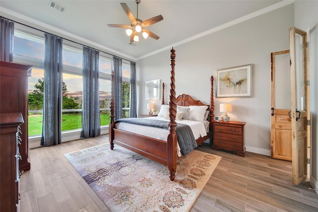 7118 Kinglet Ct, Katy, TX 77493 - bedroom featuring ornamental molding, light wood-type flooring, baseboards, and ceiling fan