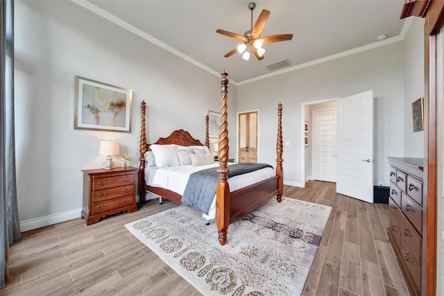 7118 Kinglet Ct, Katy, TX 77493 - bedroom with light wood-style floors, crown molding, baseboards, and ceiling fan