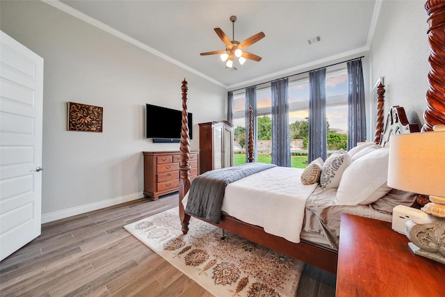 7118 Kinglet Ct, Katy, TX 77493 - bedroom with ornamental molding, wood finished floors, baseboards, ceiling fan, and lofted ceiling