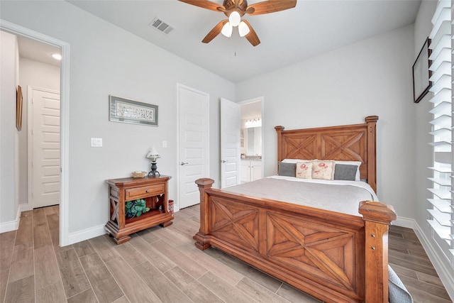 7118 Kinglet Ct, Katy, TX 77493 - bedroom featuring light wood finished floors, baseboards, ensuite bathroom, and a ceiling fan